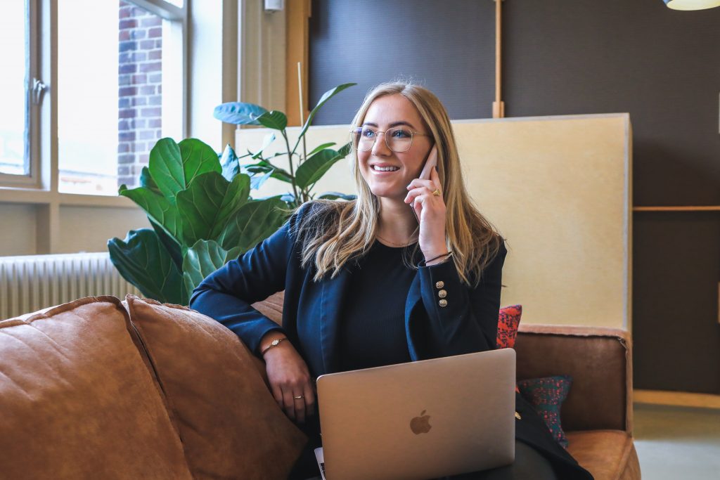 Person happy and relieved on phone