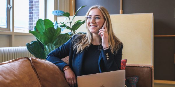 Person happy and relieved on phone